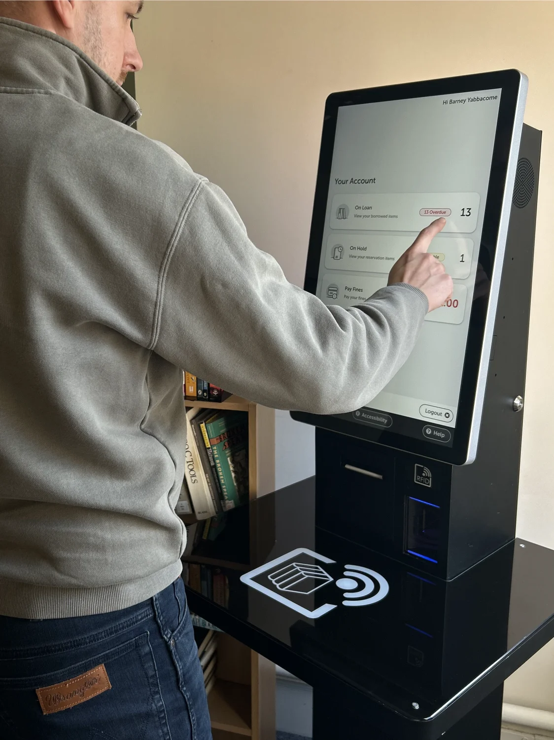 A man using the Slimline+ Kiosk